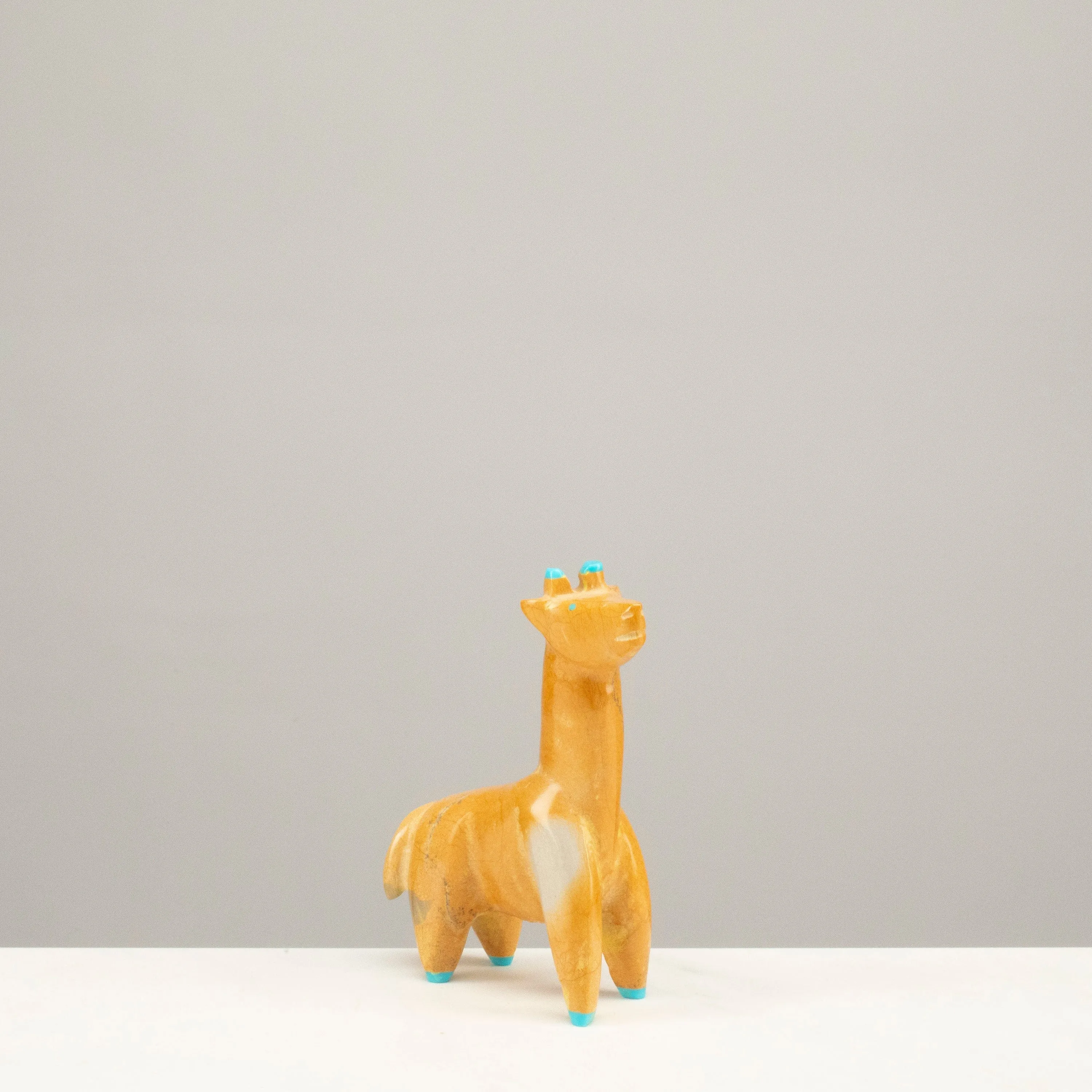 Enrike Leekya Zuni Rock and Turquoise Handmade Fetish Giraffe Carving
