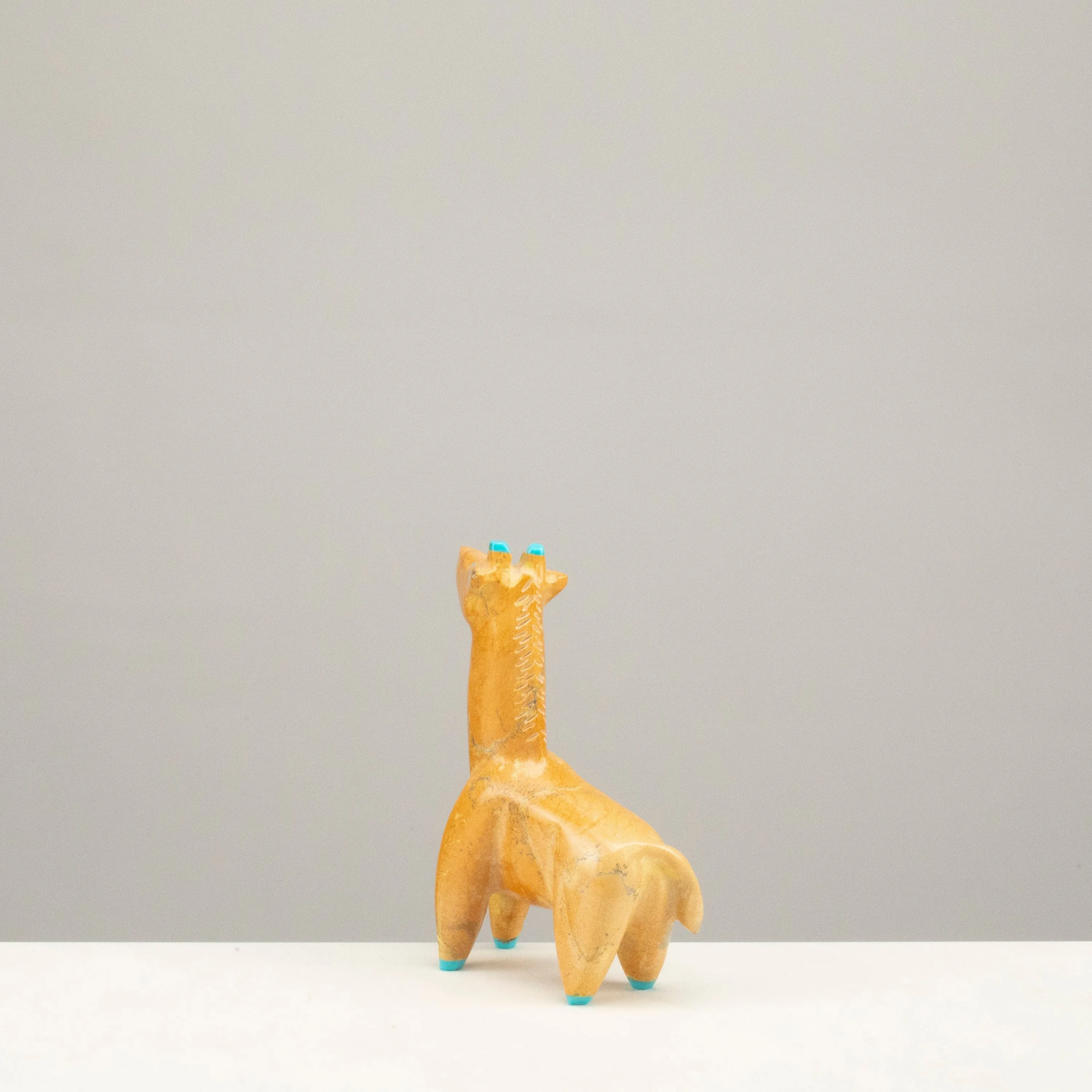Enrike Leekya Zuni Rock and Turquoise Handmade Fetish Giraffe Carving