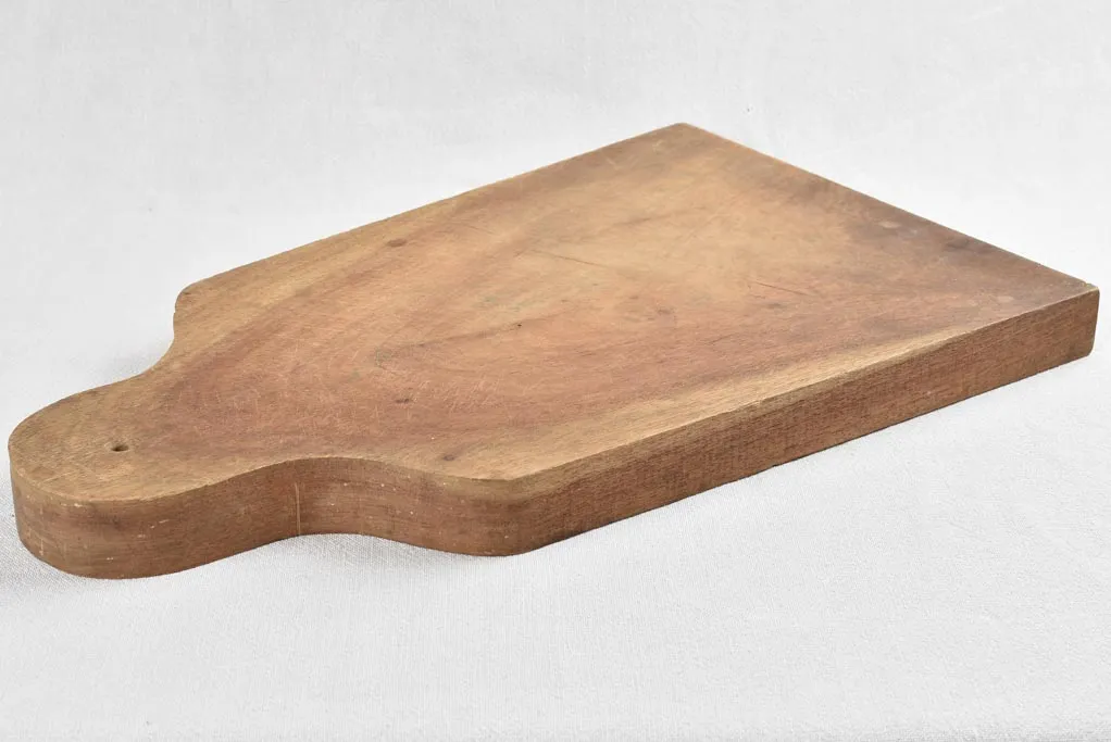 Large antique French cutting board - splayed with round handle