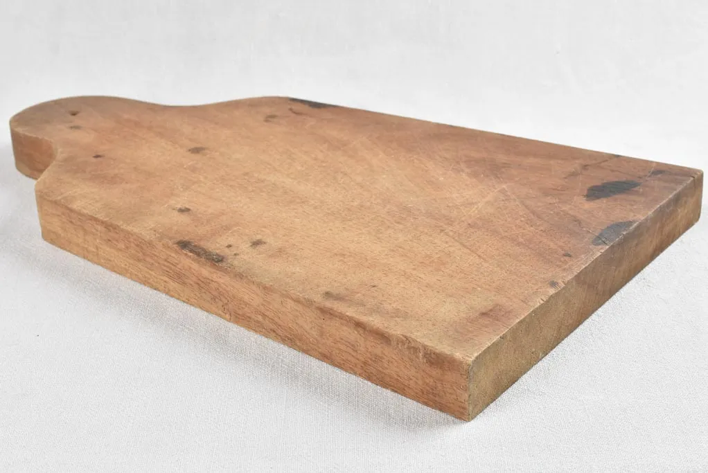 Large antique French cutting board - splayed with round handle
