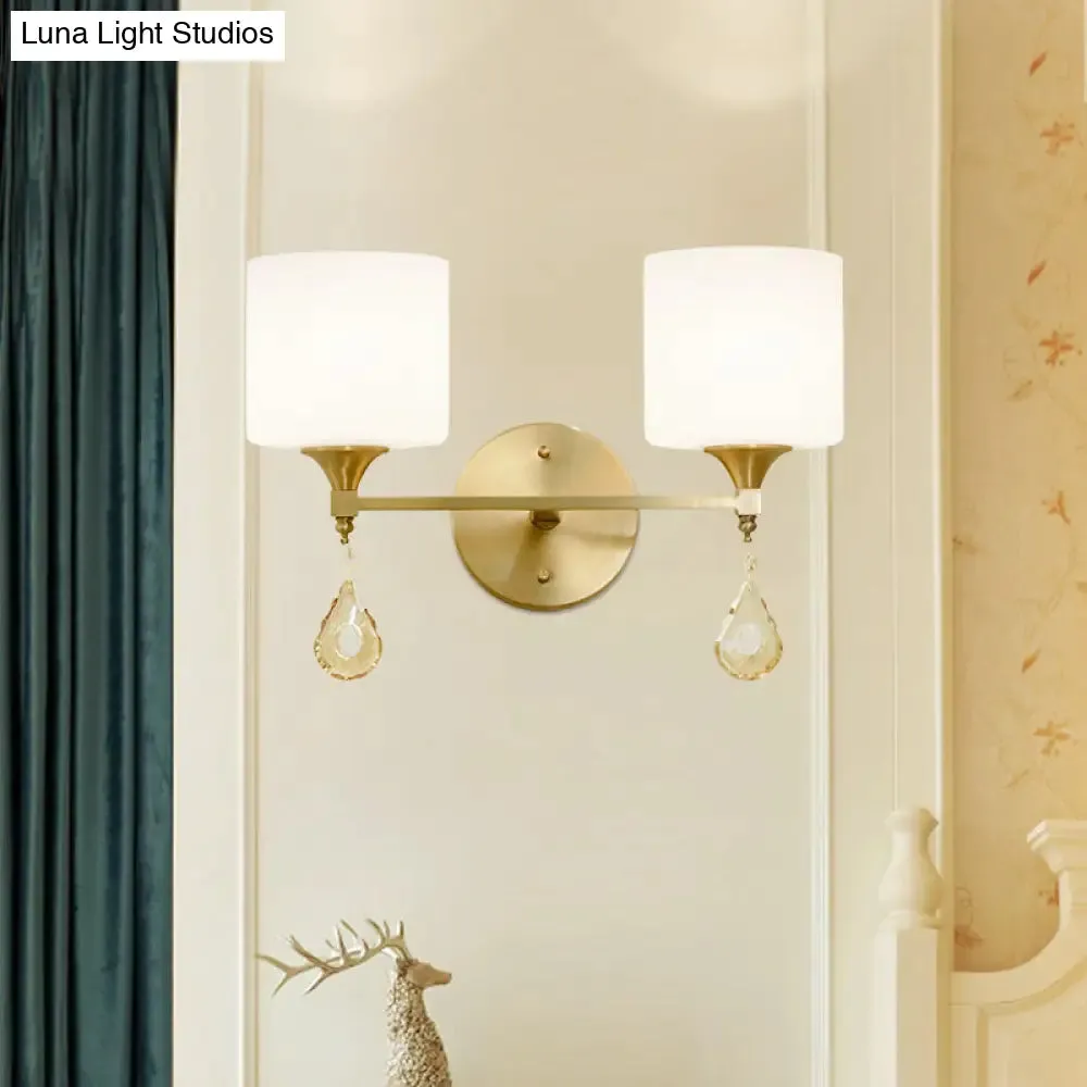 Modern Milk Glass Wall Sconce with Brass Finish and Amber Crystal Draping