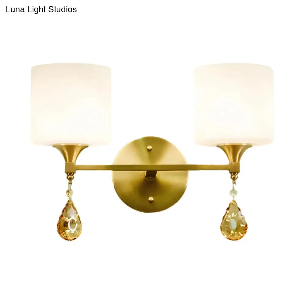 Modern Milk Glass Wall Sconce with Brass Finish and Amber Crystal Draping