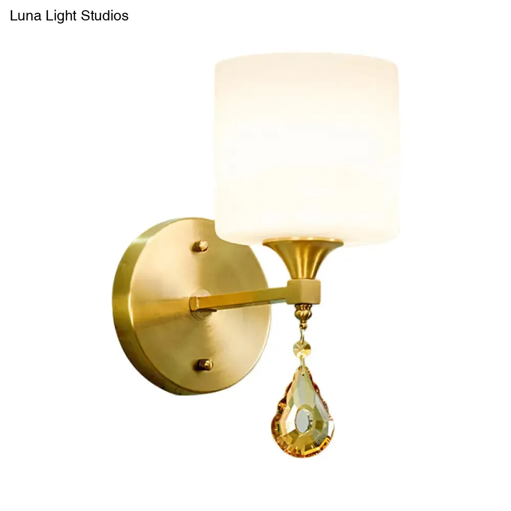 Modern Milk Glass Wall Sconce with Brass Finish and Amber Crystal Draping