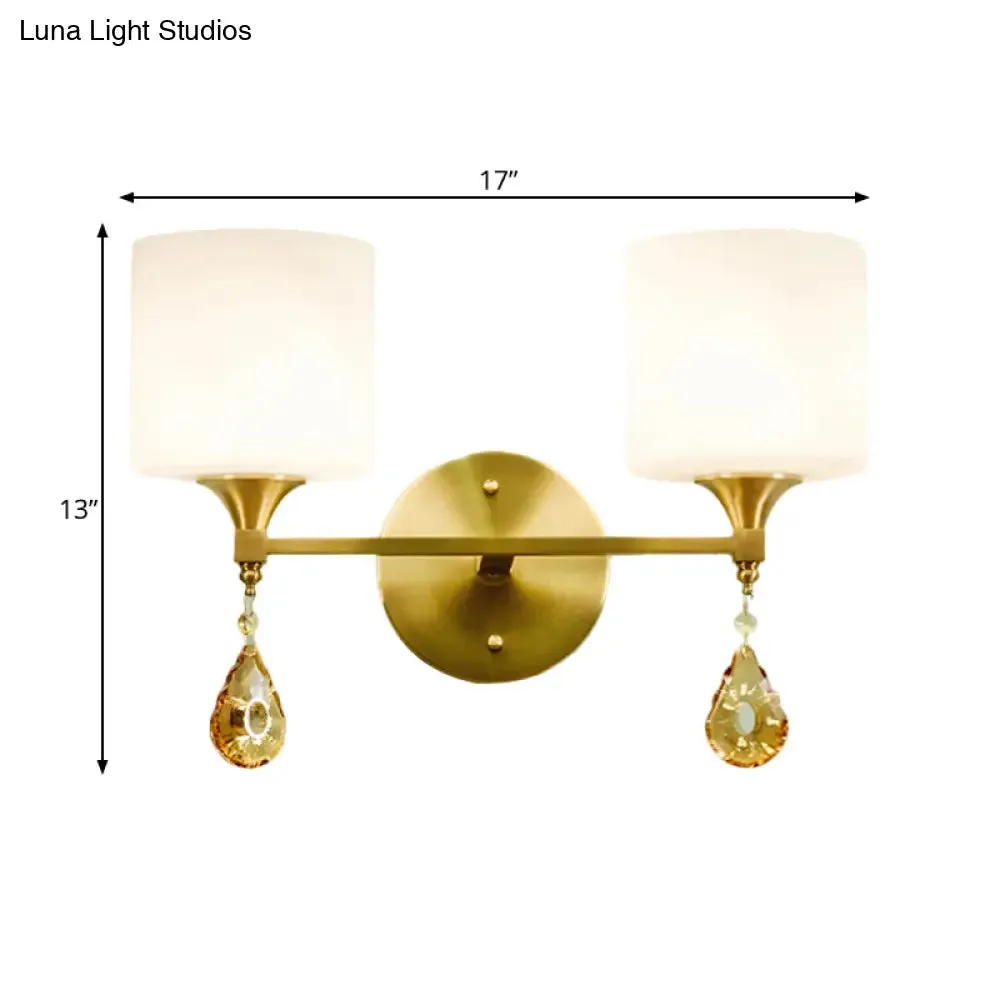 Modern Milk Glass Wall Sconce with Brass Finish and Amber Crystal Draping
